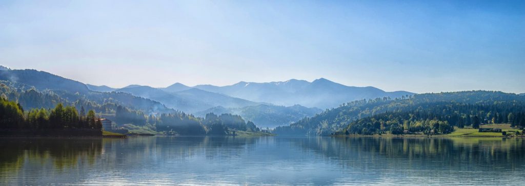 a photograph landscape at the foot of a lake for creative writing inspiration