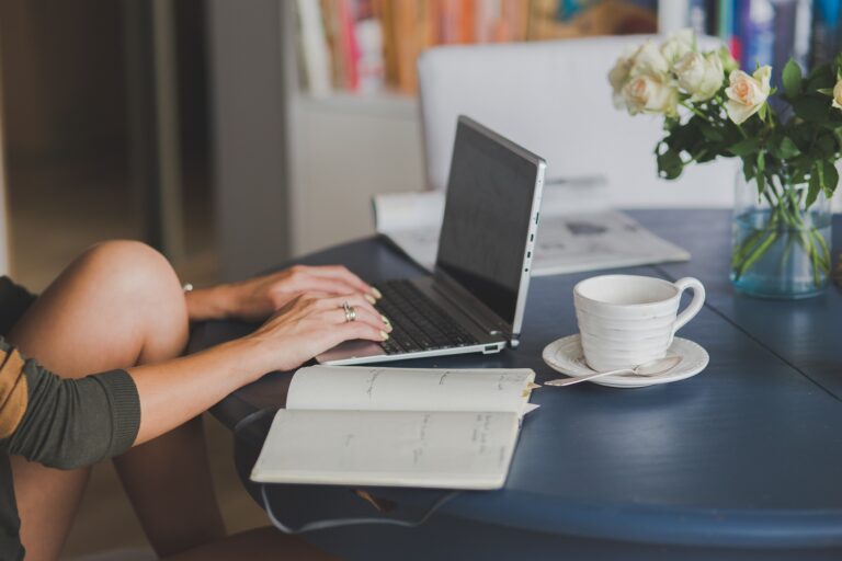 women doing imaginative writing on laptop