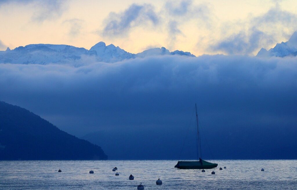 a boat sailing on a lake for writer inspiration