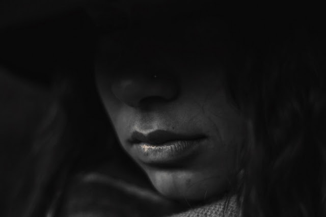 hooded women from a mystery flash fiction