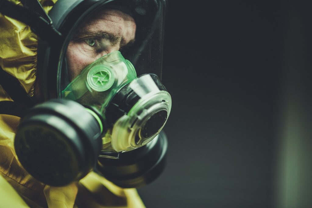 a man wearing a hasmat suit as inspiration for a dystopian writing prompt